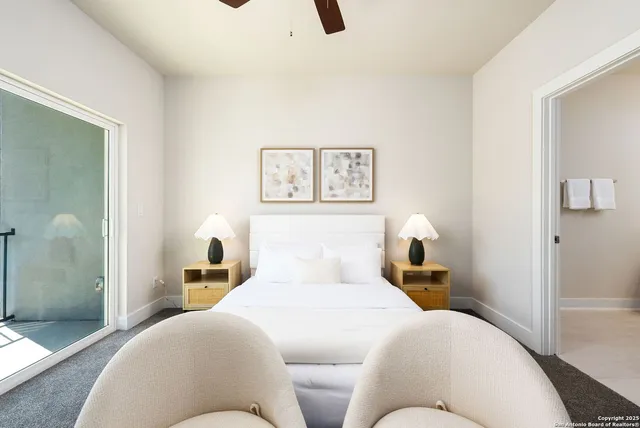 a bedroom with a bed and painting on the wall