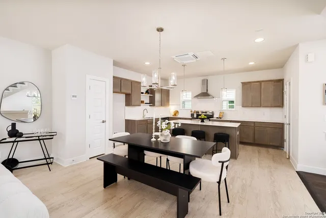 a view of kitchen with dining table and chairs