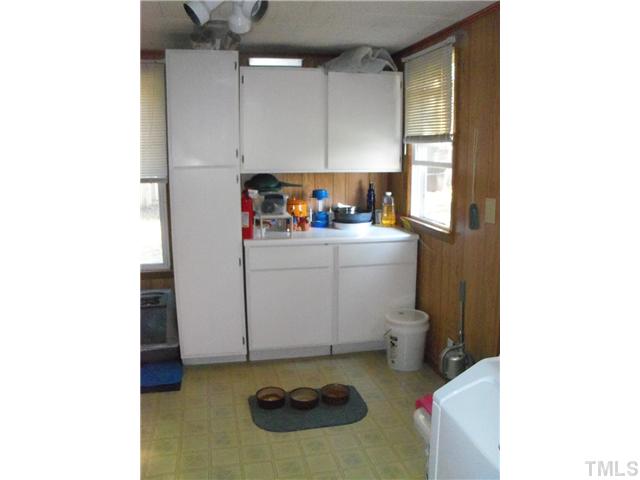 1234 Pointer Street Roxboro, NC 27573 - Photo 11 of 17 Utility room is 9.1x8.9 and offer plenty of storage. You have all sorts of room for folding and doing your laundry.