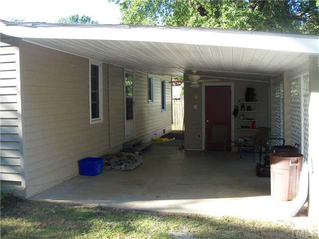 1234 Pointer Street Roxboro, NC 27573 - Photo 14 of 17 Covered carport with storage area is located on the backside of the house
