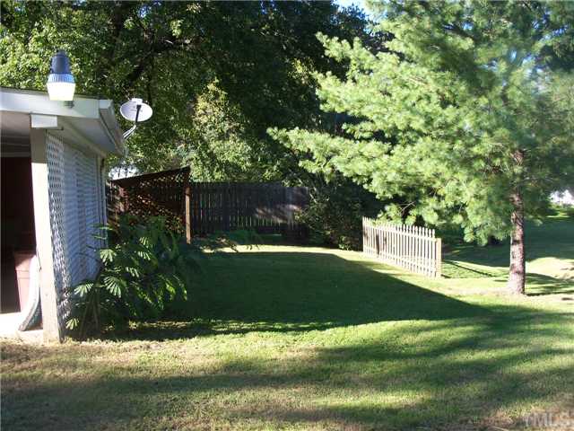 1234 Pointer Street Roxboro, NC 27573 - Photo 16 of 17 Will not take long to cut the grass at this neat property. Small storage area, privacy fence, shade trees, nicely landscaped
