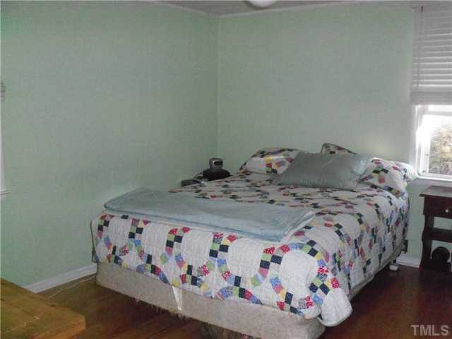 1234 Pointer Street Roxboro, NC 27573 - Photo 7 of 17 Master Bedroom has hardwood floor, walk in closet and private bath