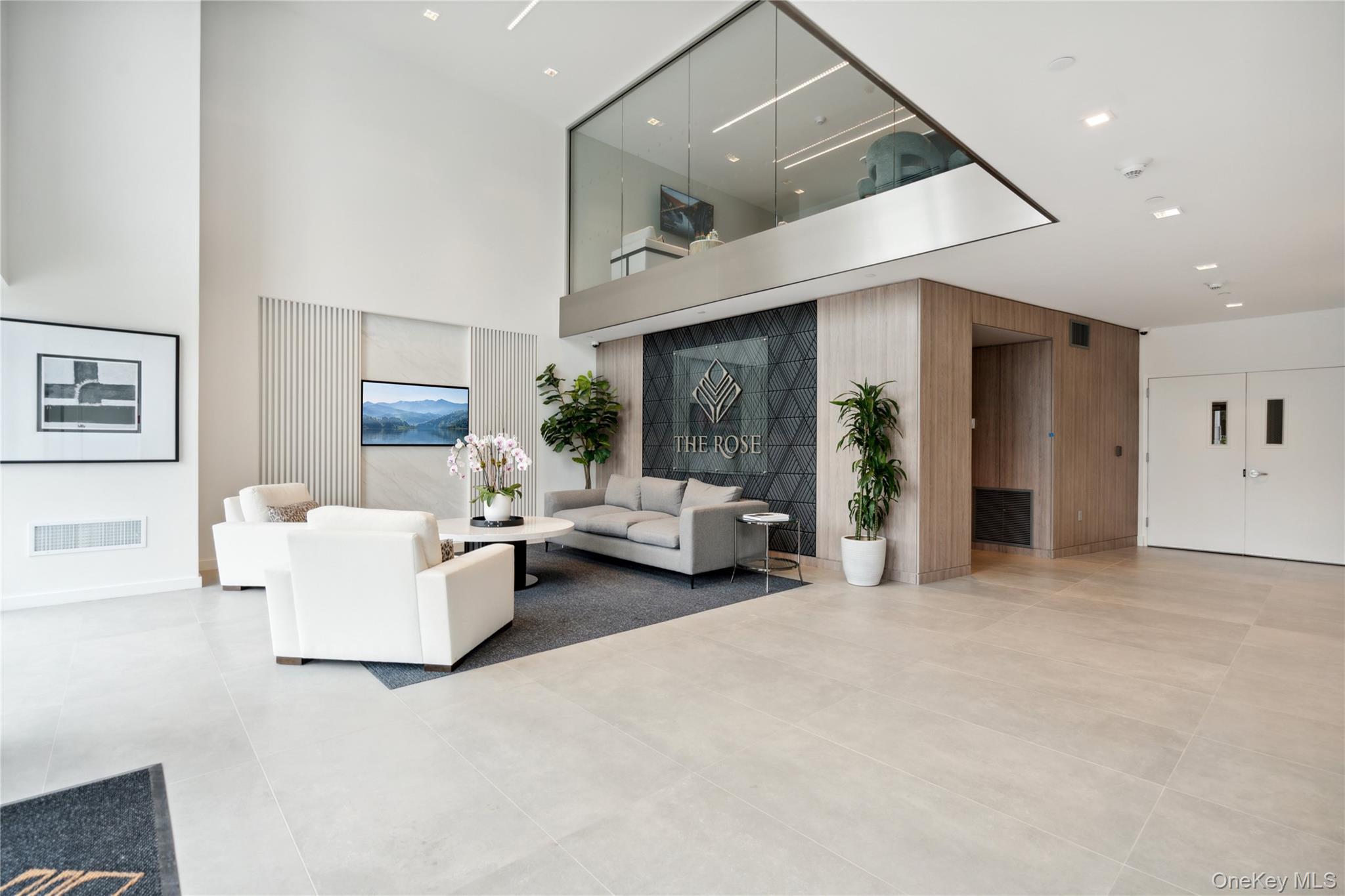 218 Middle Neck Road, Unit 211 Great Neck, NY 11021 - Photo 9 of 20 Community lobby featuring a high ceiling and recessed lighting