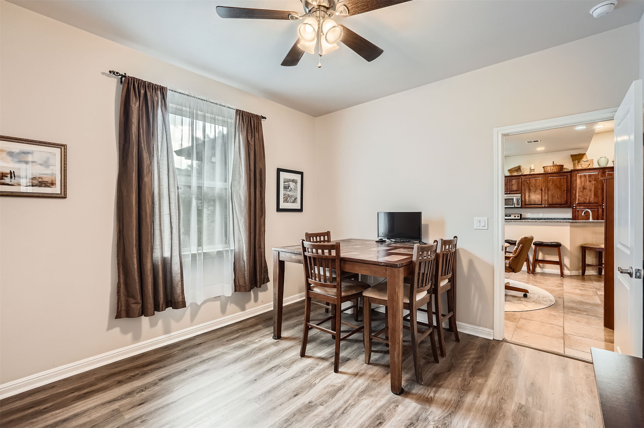 5501 Hitching Post Lago Vista, TX 78645 - Photo 19 of 26 a view of a dining room with furniture and window