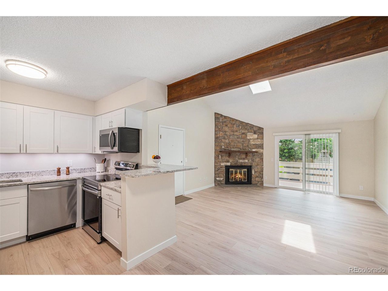 a kitchen with a sink and a stove top oven