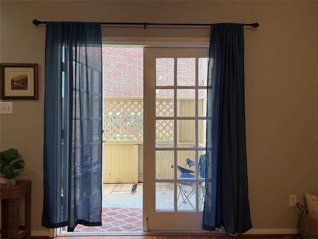 a view of walk in closet with large windows