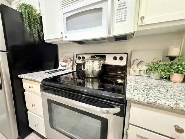 a close view of a stove top oven sitting inside of a kitchen
