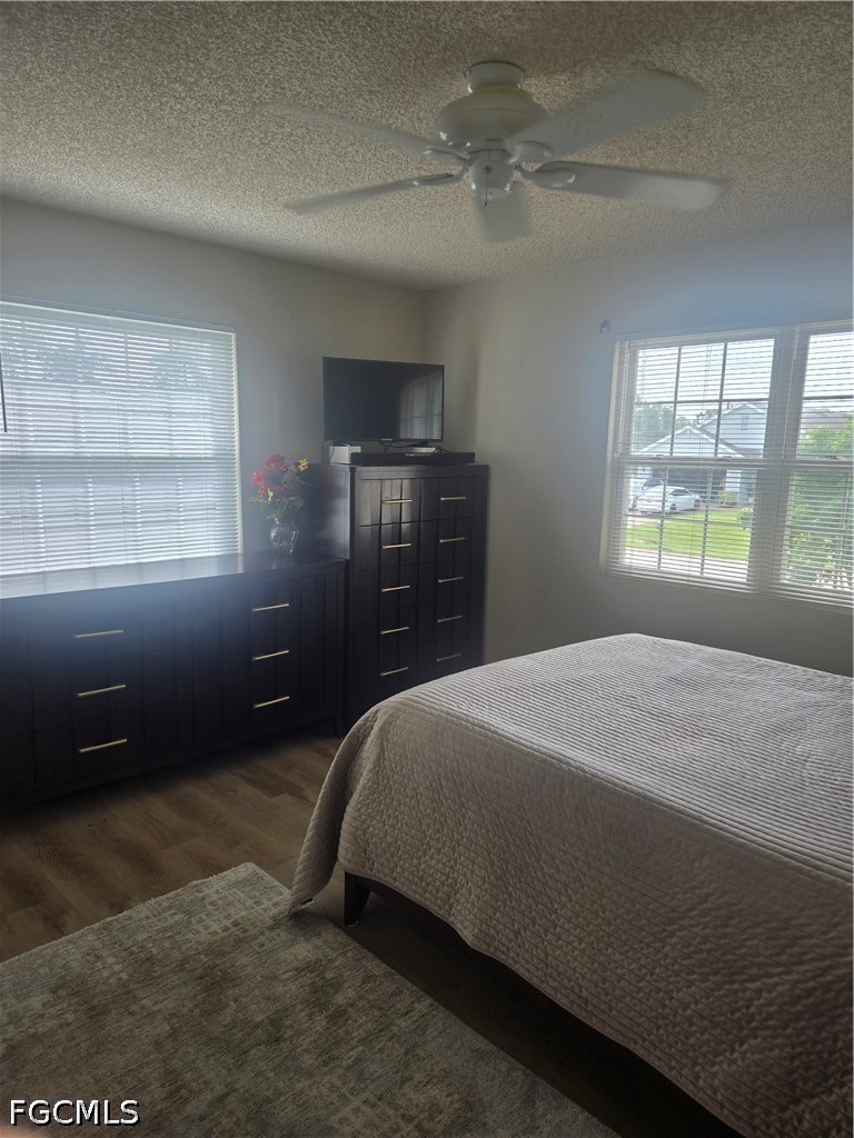 8093 Anhinga Road Fort Myers, FL 33967 - Photo 19 of 49 a bedroom with a bed and a window