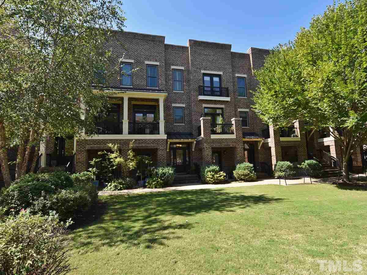 520 John Haywood Way, Unit 102 Raleigh, NC 27604 - Photo 11 of 18 front view of house with a yard