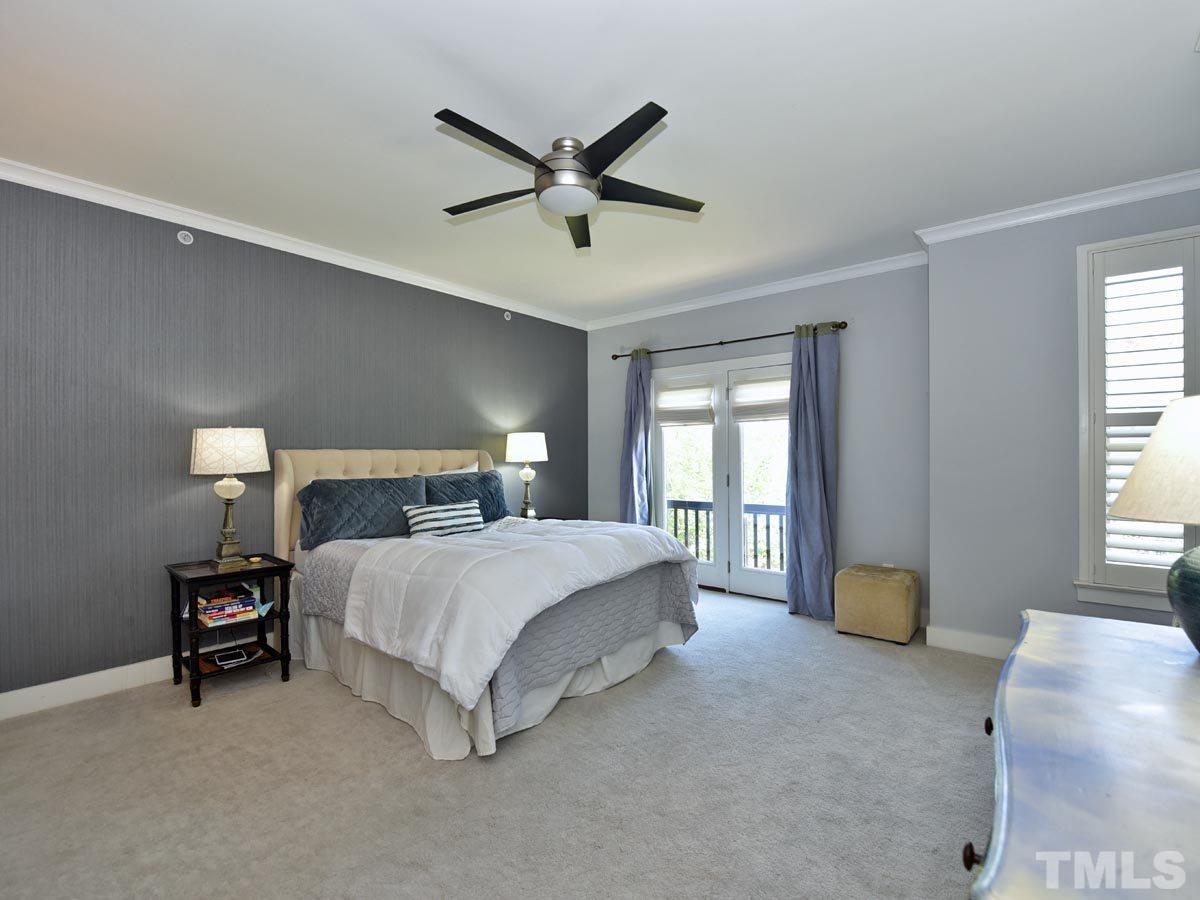 520 John Haywood Way, Unit 102 Raleigh, NC 27604 - Photo 13 of 18 a bedroom with a bed and window
