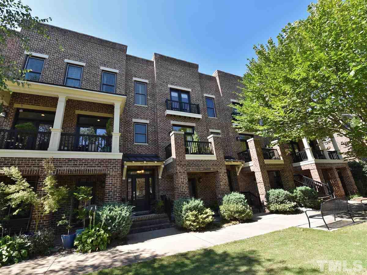 520 John Haywood Way, Unit 102 Raleigh, NC 27604 - Photo 16 of 18 a view of a building with a garden