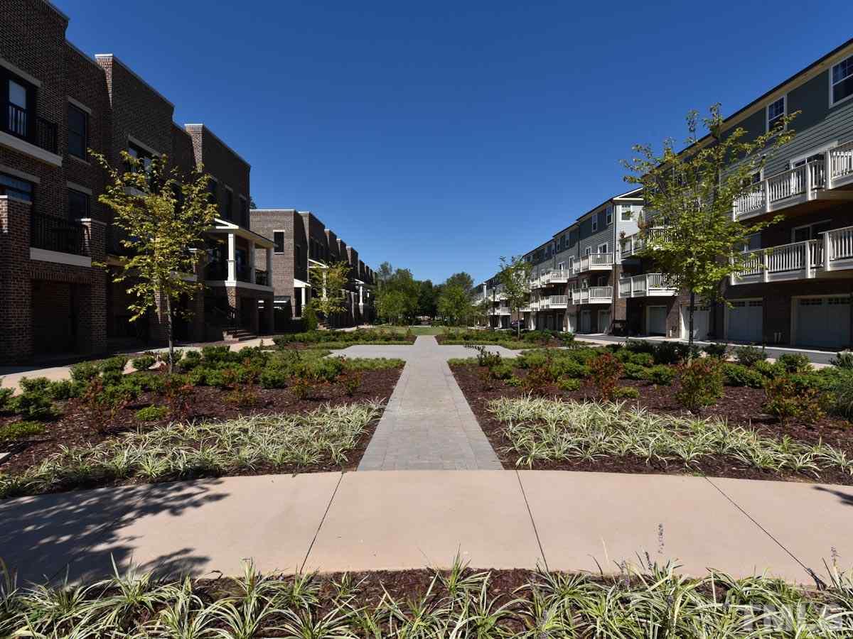 520 John Haywood Way, Unit 102 Raleigh, NC 27604 - Photo 18 of 18 a view of multiple houses with a street