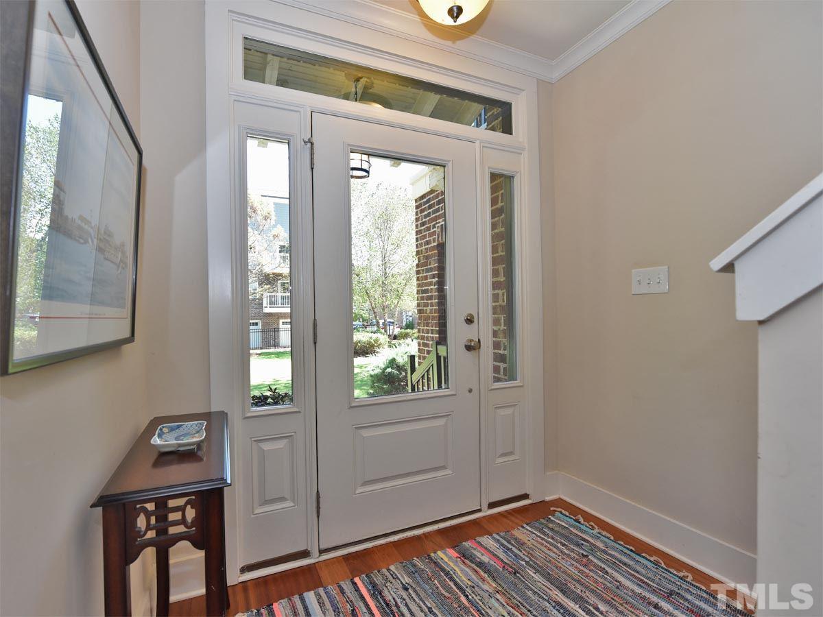 520 John Haywood Way, Unit 102 Raleigh, NC 27604 - Photo 2 of 18 a view of an entryway with wooden floor