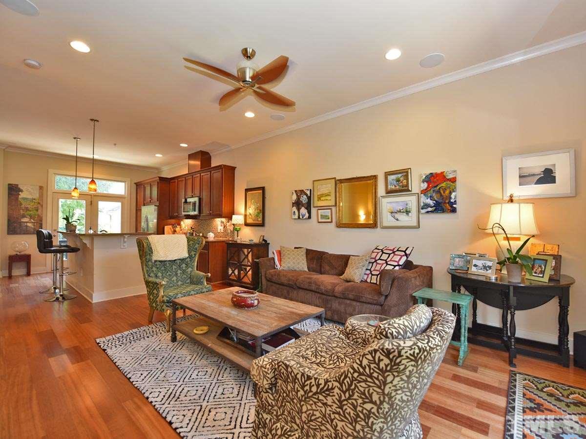 520 John Haywood Way, Unit 102 Raleigh, NC 27604 - Photo 4 of 18 a living room with furniture and a wooden floor