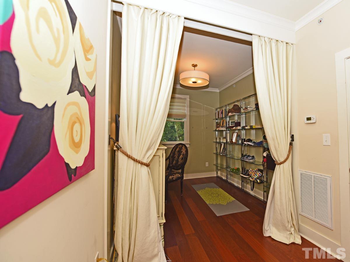 520 John Haywood Way, Unit 102 Raleigh, NC 27604 - Photo 9 of 18 a view of walk in closet with clothes and shoes