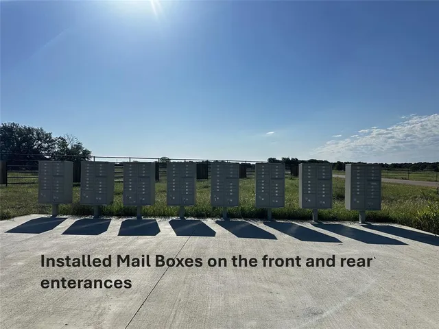 a view of a street with a building in the background