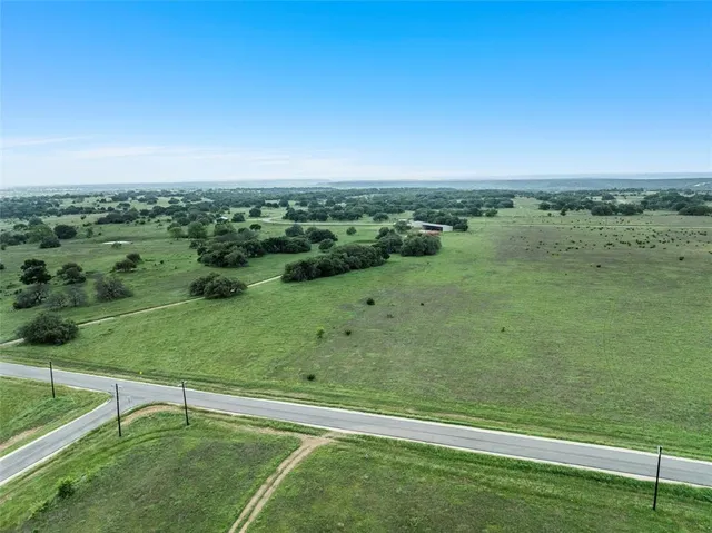 a view of a green field with clear sky