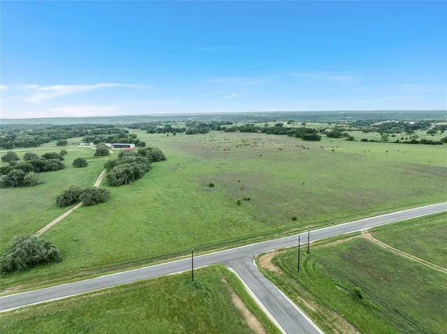 a view of a lake with a yard