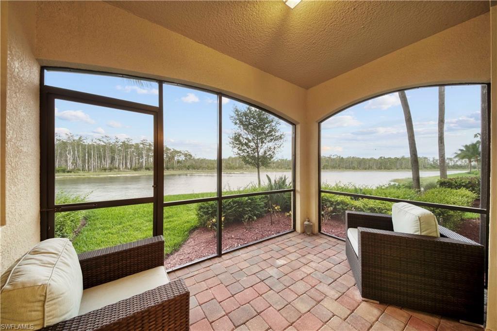 9572 Trevi Court, Unit 5017 Naples, FL 34113 - Photo 18 of 25 a living room with couch and city view