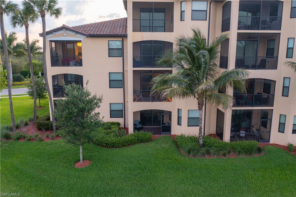 9572 Trevi Court, Unit 5017 Naples, FL 34113 - Photo 19 of 25 a house view with a garden space