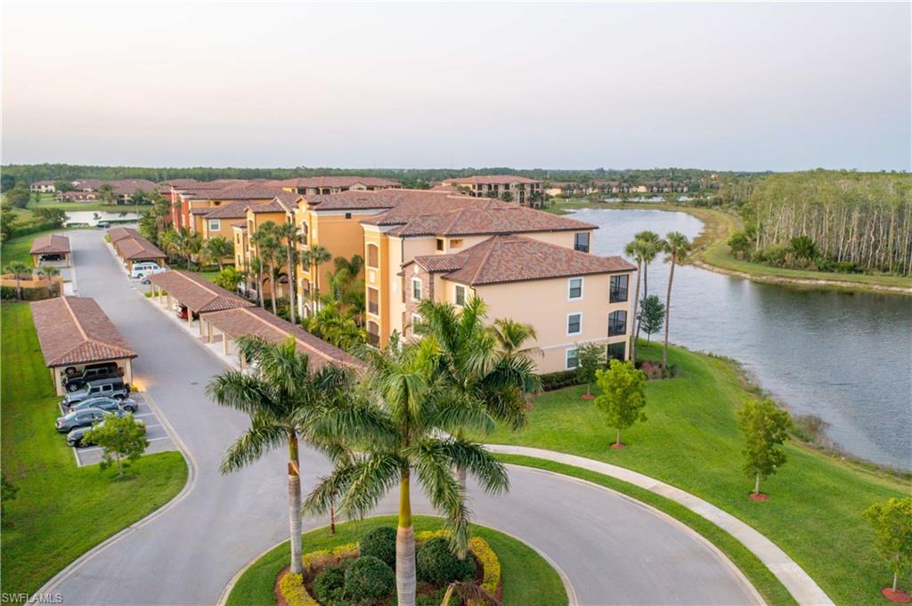 9572 Trevi Court, Unit 5017 Naples, FL 34113 - Photo 21 of 25 an aerial view of residential houses with outdoor space and lake view