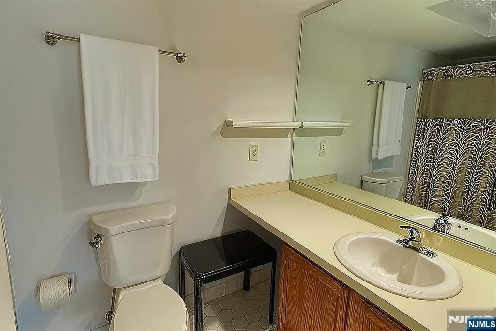 2210 Hilltop Road Mahwah, NJ 07430 - Photo 13 of 14 a bathroom with a sink toilet and shower
