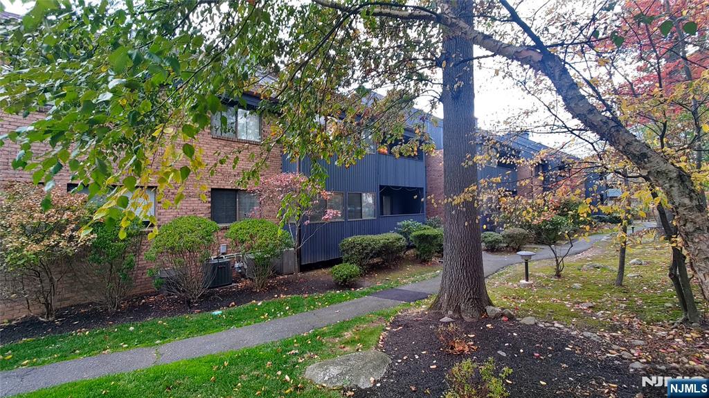 2210 Hilltop Road Mahwah, NJ 07430 - Photo 2 of 14 a front view of a house with a garden