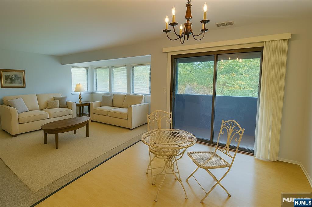 2210 Hilltop Road Mahwah, NJ 07430 - Photo 7 of 14 a living room with furniture and a window