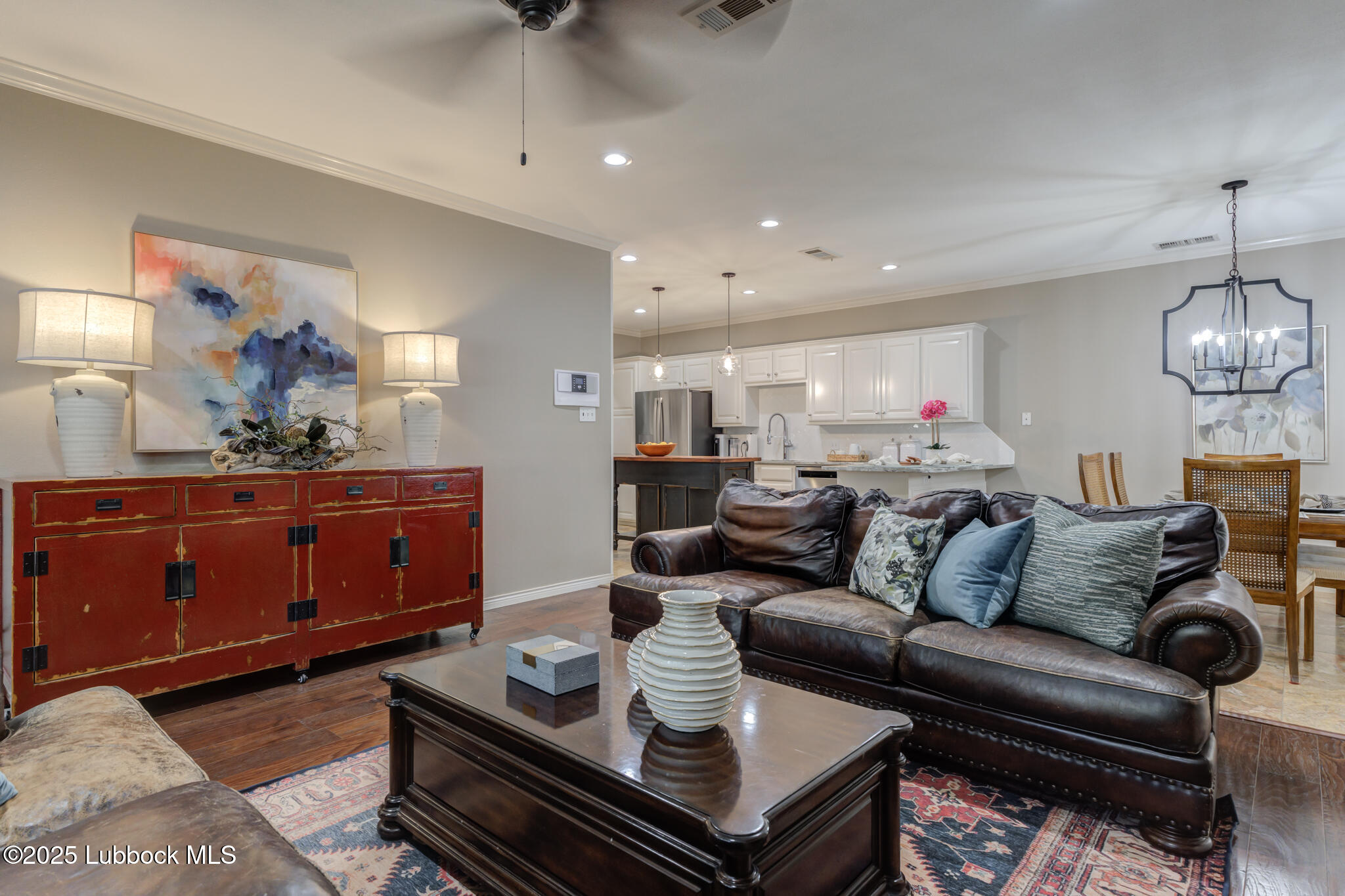 9406 Wayne Avenue Lubbock, TX 79424 - Photo 12 of 67 a living room with furniture and a view of kitchen