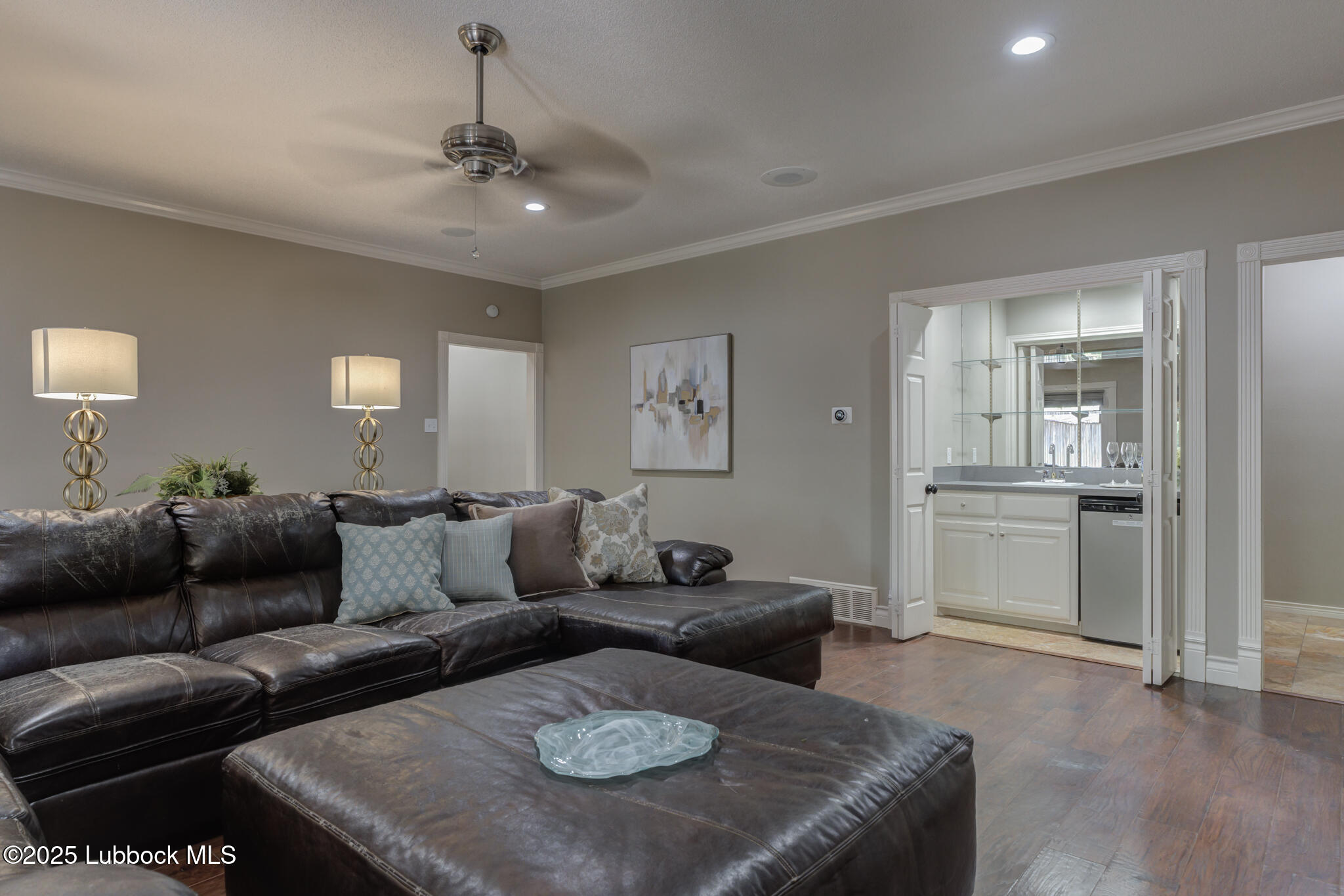 9406 Wayne Avenue Lubbock, TX 79424 - Photo 29 of 67 a living room with furniture and view of kitchen