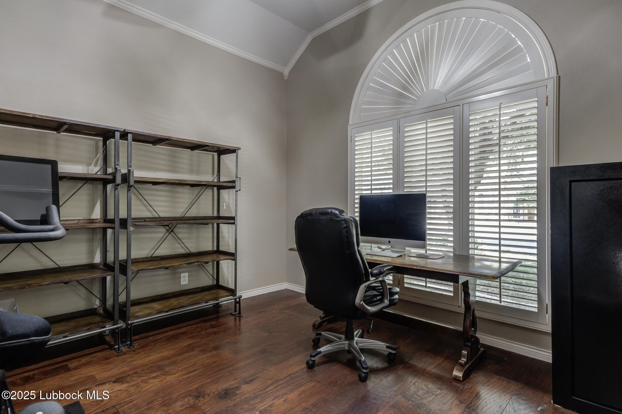 9406 Wayne Avenue Lubbock, TX 79424 - Photo 44 of 67 a view of a workspace with furniture and a window