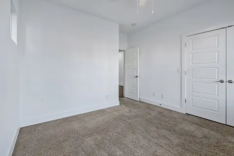 a bathroom with a granite countertop toilet a sink and a bathtub