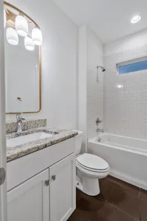a bathroom with a bathtub and a toilet