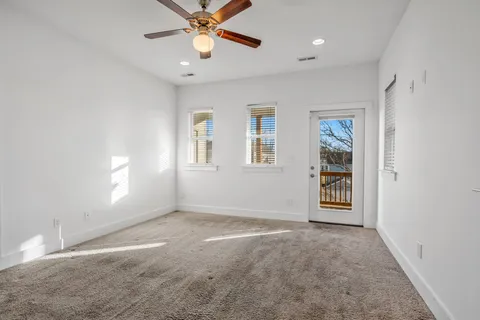 a view of an empty room with a bathroom