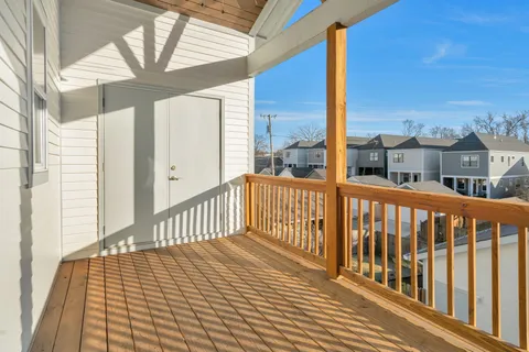 a view of a brick house with large windows