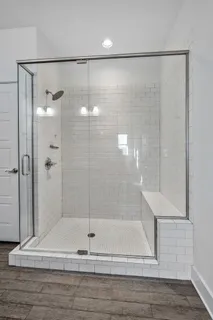 a bathroom with a granite countertop sink a toilet and bathtub