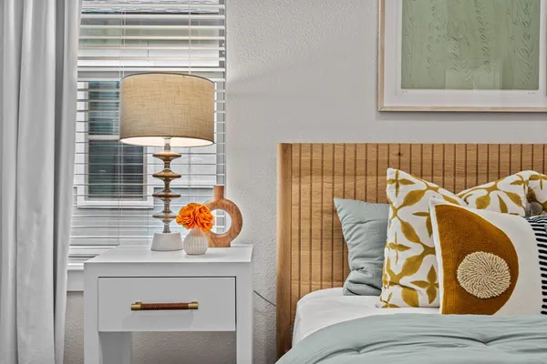 a living room with a couch and dresser