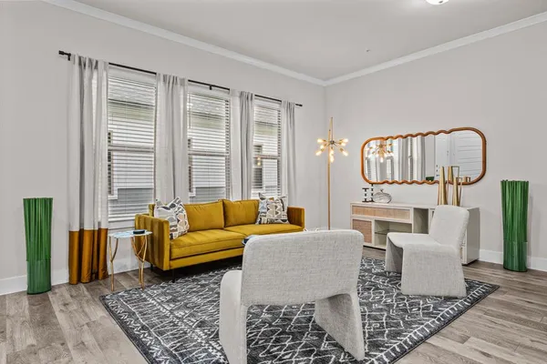 a living room with furniture and a rug