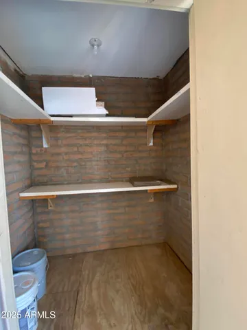 a balcony with table and chairs