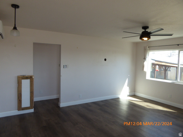533 East 100 North Price, UT 84501 - Photo 2 of 6 Spacious room featuring wood-finish flooring, a contemporary ceiling fan with integrated lighting, and white baseboards