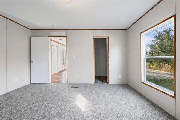 a view of an empty room with a window