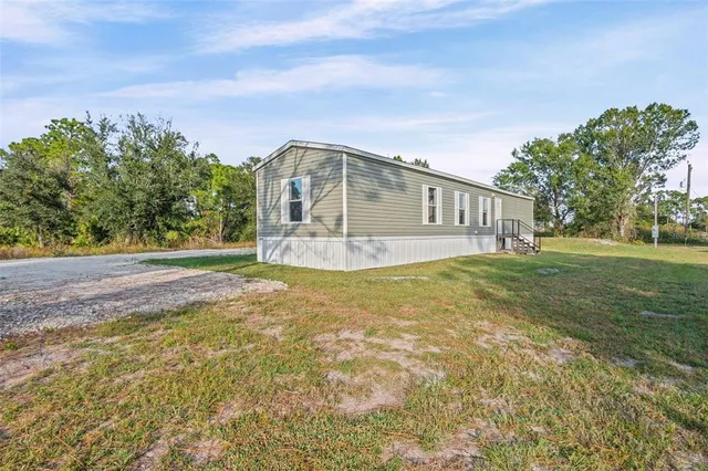 a view of a house with a big yard