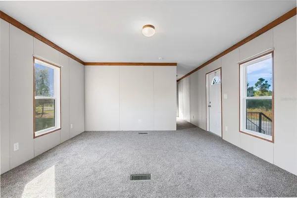 a view of an empty room with a window