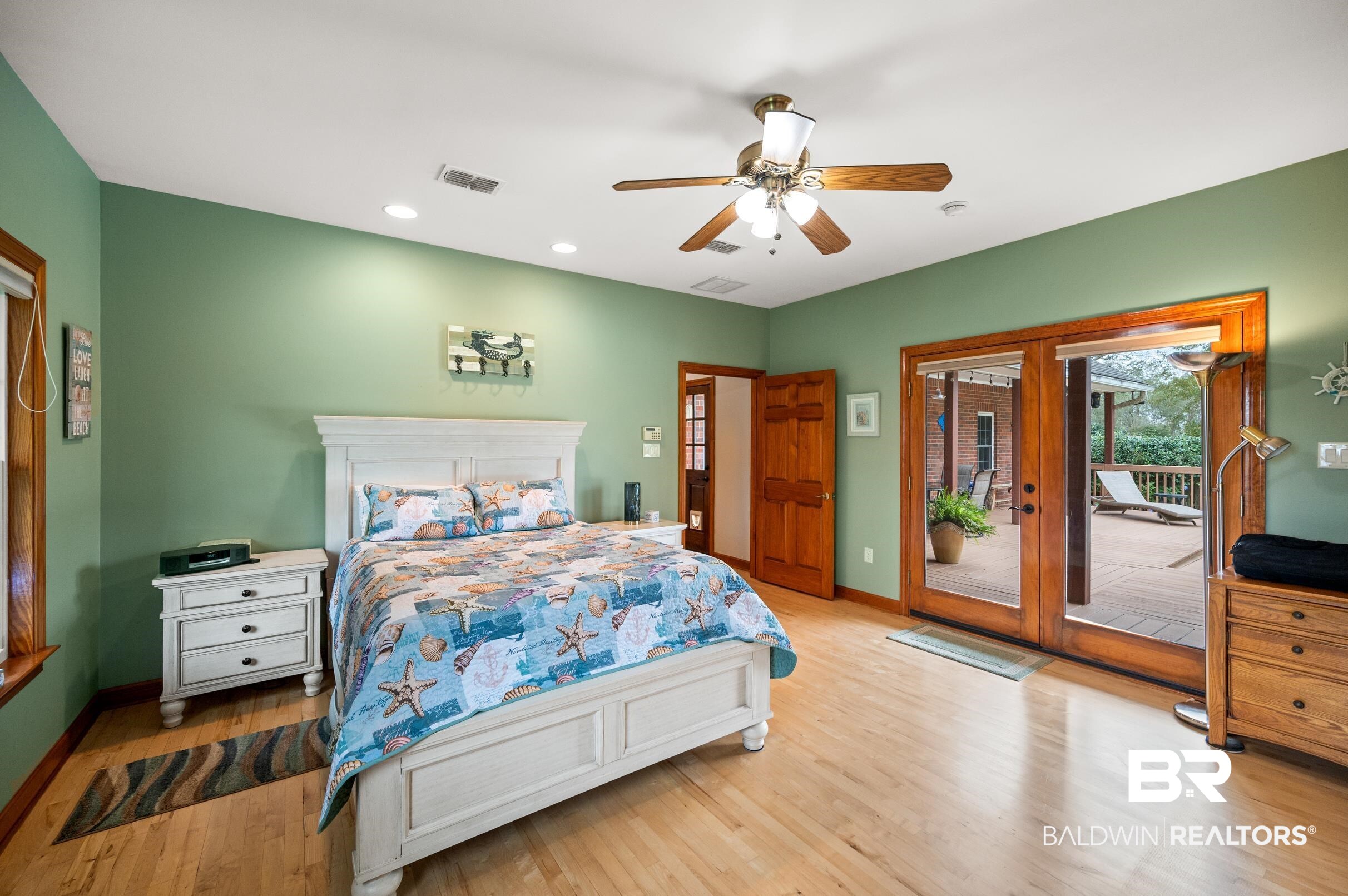 13871 Underwood Road Summerdale, AL 36580 - Photo 10 of 33 Bedroom featuring access to exterior, ceiling fan, french doors to fenced Pool area.