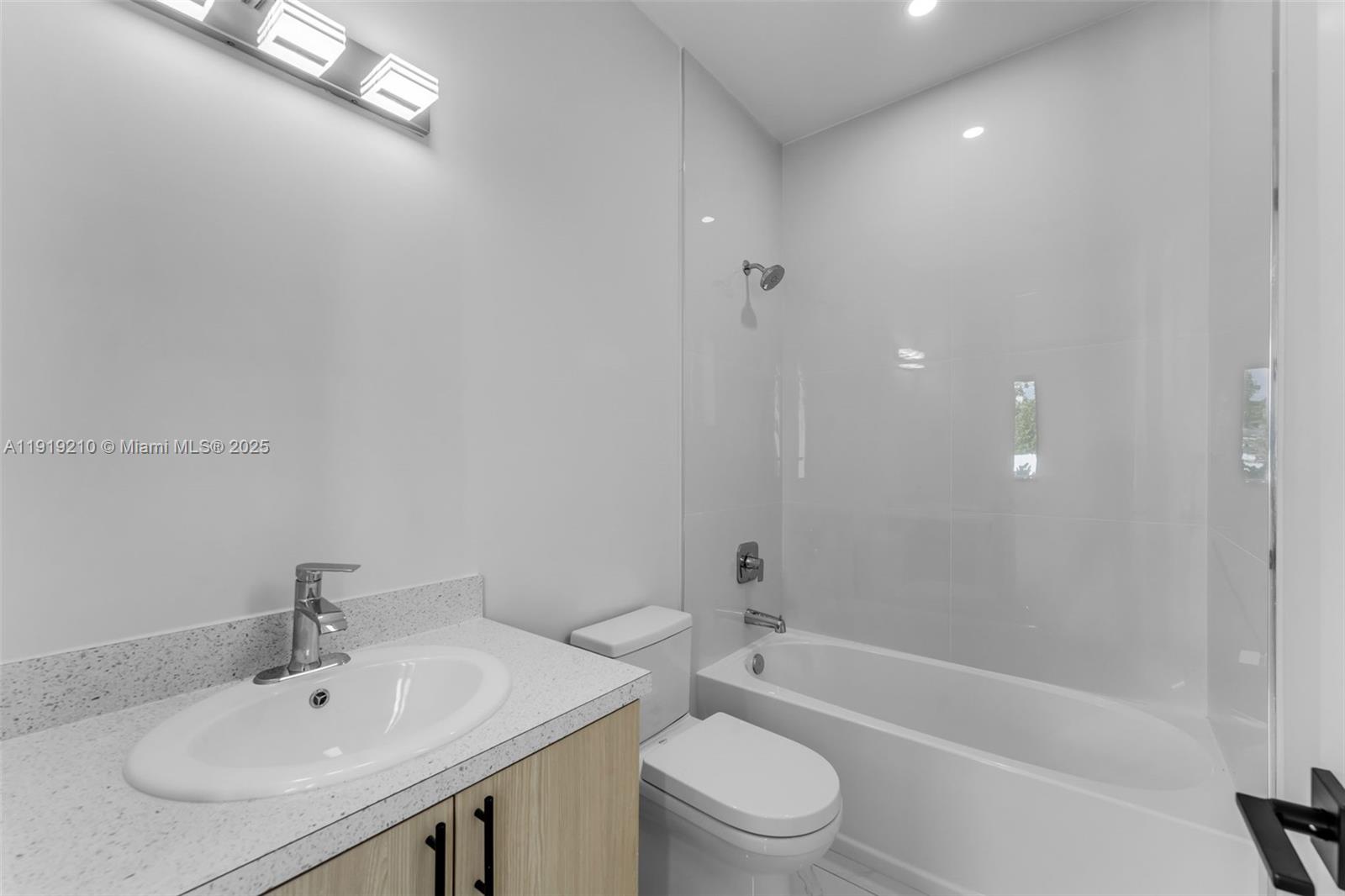 12383 Southwest 220th Street Miami, FL 33170 - Photo 11 of 20 a bathroom with a sink toilet and bathtub