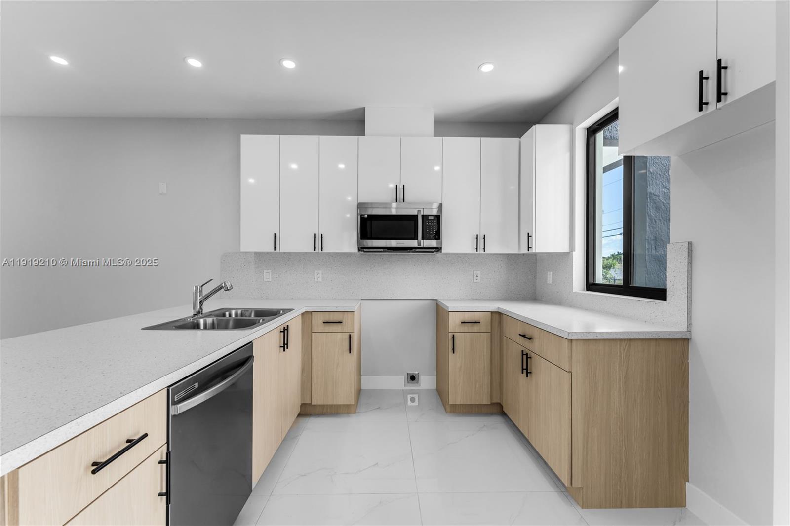 12383 Southwest 220th Street Miami, FL 33170 - Photo 4 of 20 a kitchen with a sink stove and refrigerator