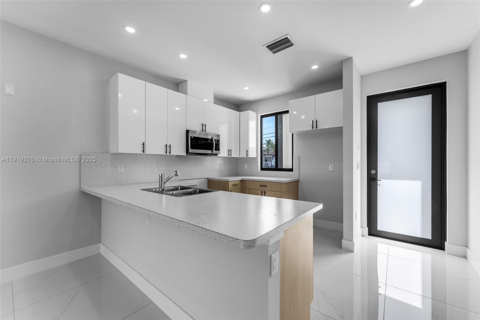 12383 Southwest 220th Street Miami, FL 33170 - Photo 5 of 20 a large kitchen with stainless steel appliances granite countertop a lot of counter space and a sink