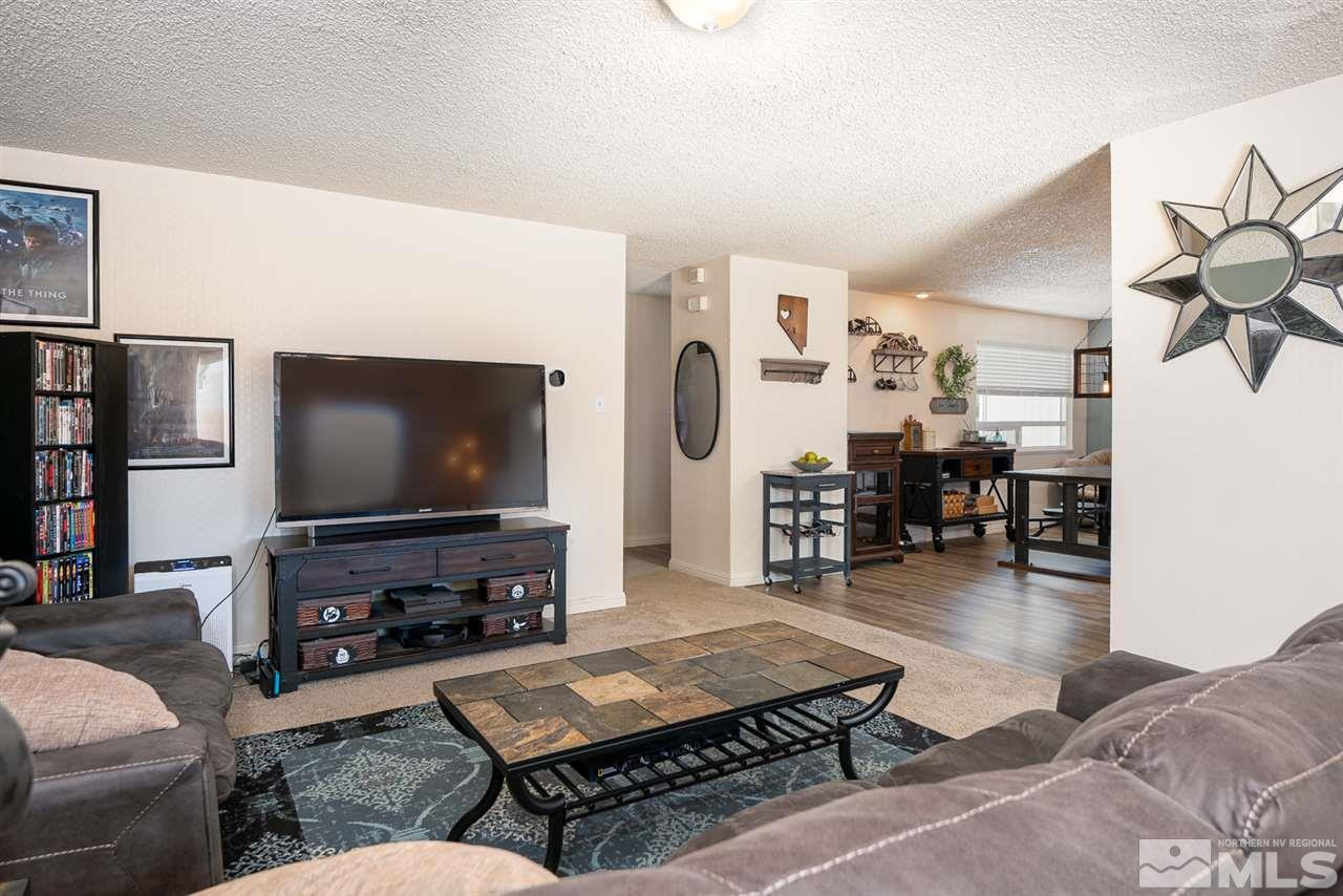 3425 Pierremont Road Reno, NV 89503 - Photo 13 of 28 a living room with furniture and a flat screen tv