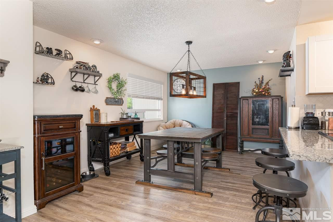 3425 Pierremont Road Reno, NV 89503 - Photo 14 of 28 a view of a dining room with furniture and wooden floor