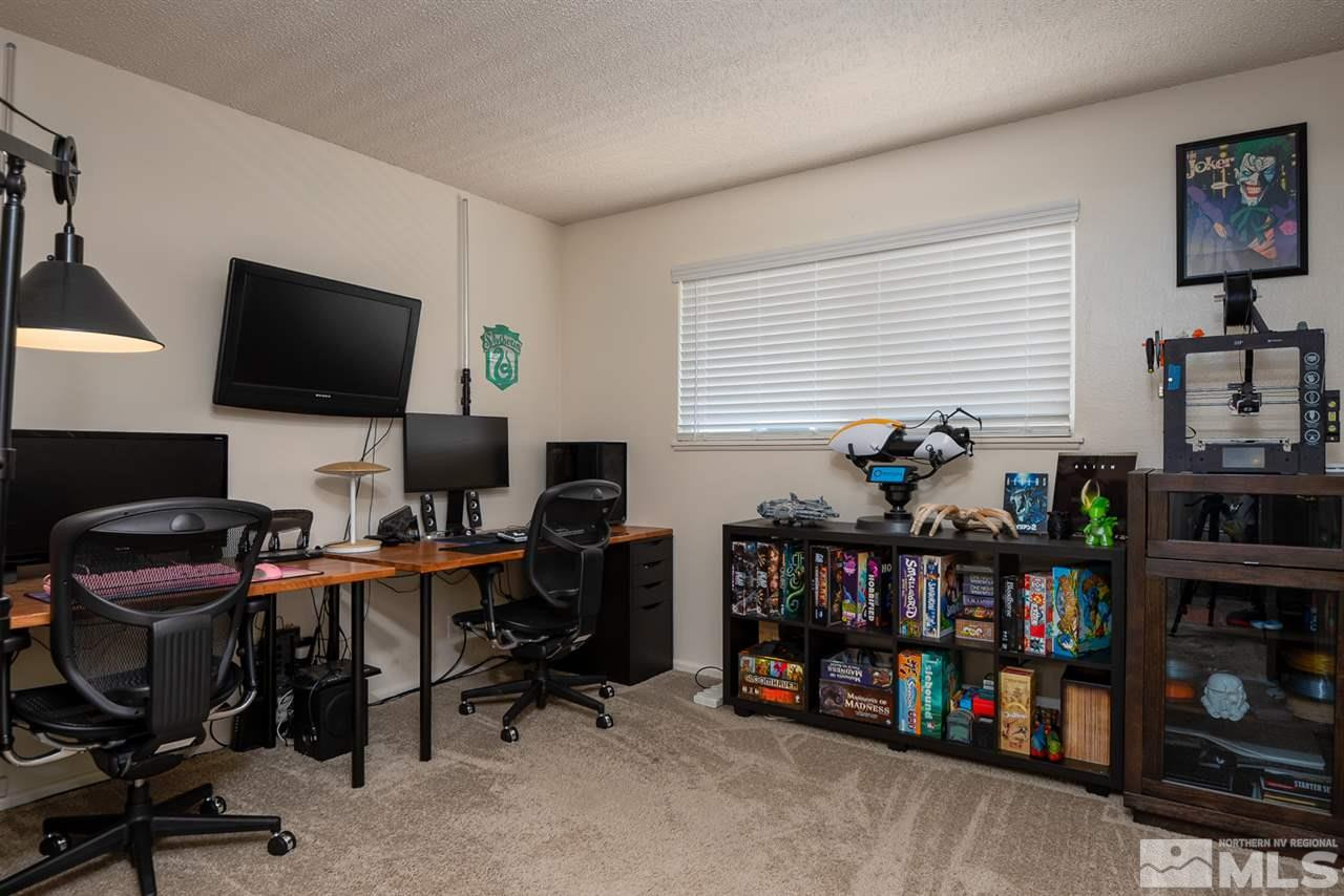 3425 Pierremont Road Reno, NV 89503 - Photo 22 of 28 a work room with furniture and a flat screen tv